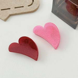 Sparkly glitter heart-shaped hair claws in red and pink colors for women hair styling