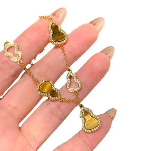 18K gold plated tiger eye hollow gourd bracelet with sparkling crystal accents for women