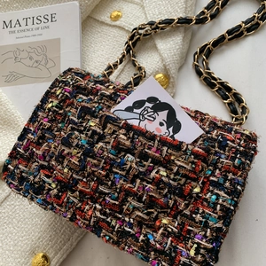 Elegant multi-color tweed crossbody bag with golden chain strap on a white background