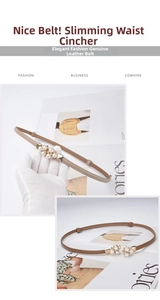 Detail of elegant khaki cowhide belt with gold pearl and rhinestone buckle design