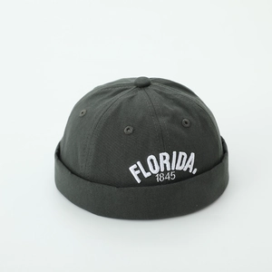 Close-up of charcoal grey docker hat with white Florida 1845 embroidery details