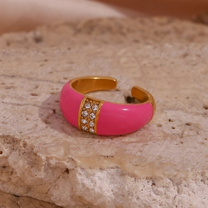 Detail of gold open ring with pink enamel and double rows of sparkling crystals