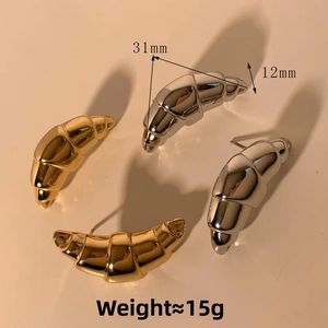 Detailed view of croissant dome earrings showing 31mm size and metal finish