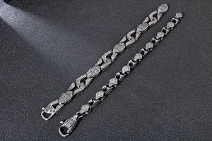 Detailed view of vintage silver geometric punk bracelets with Nordic engraved patterns
