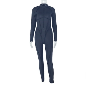 Detail of grey catsuit showing front zipper, stand collar, and slim fit athletic design