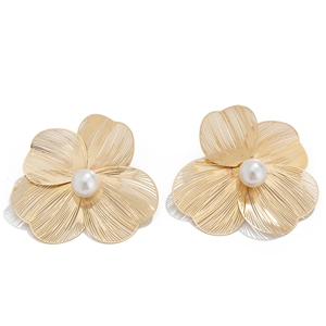 Detail of golden floral earrings with wire mesh petals and a white center pearl