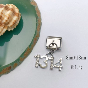 Detailed macro of silver number 1314 charm with zircon stones for DIY bracelets