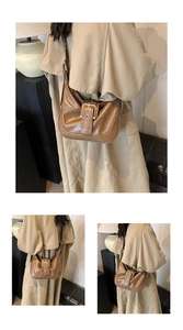 Macro shot of brown faux leather vintage shoulder bag featuring a metallic belt buckle detail