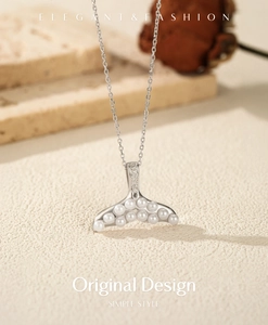 Detailed view of S925 silver mermaid tail pendant with white pearls and crystals