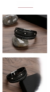 Detailed close-up of multilayered black braided leather bracelet with stainless steel magnetic clasp