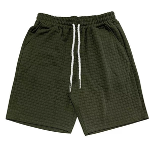 Detail of olive green waffle texture shorts with contrast white drawstring waist