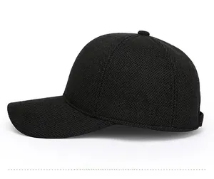 Detail of side sports embroidery and knitted texture on black winter ear protection cap