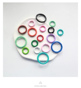 Detailed view of colorful 2.5cm lacquered metal spring O-rings for DIY accessories