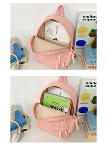 Pink nylon backpack interior showing spacious storage for tablets and school books