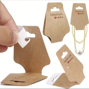 Kraft paper display cards for necklaces with Handmade with Love text and hanging holes
