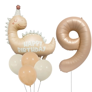 Detail of matte cream dinosaur and number 9 balloon set for child's birthday party