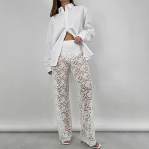 Pantaloni bianchi sexy in pizzo a vita alta con eleganti dettagli patchwork trasparenti