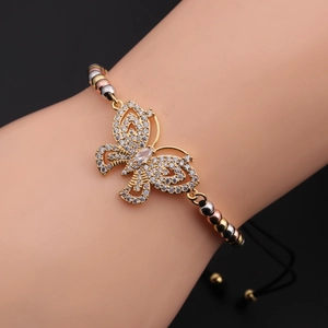 Detail of butterfly zircon pendant bracelet with gold finish and adjustable black cord