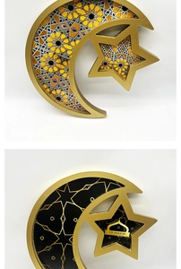 Close-up of crescent moon and star trays with golden edges and Eid Mubarak patterns