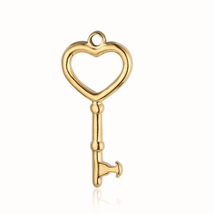 Close-up of a golden heart-shaped key pendant made of vintage-style stainless steel
