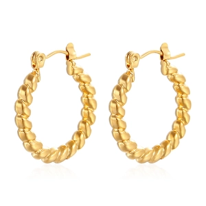 Polished gold plated titanium steel twist hoop earrings with woven texture on white background