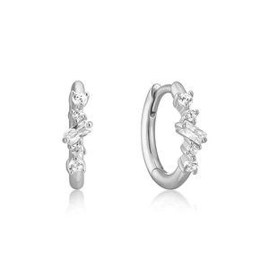 Macro shot of silver cluster earrings with rectangular and round zirconia stones