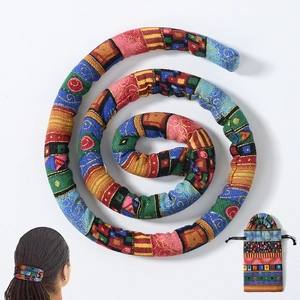 Detailed view of colorful dreadlock hair tie with matching storage drawstring pouch