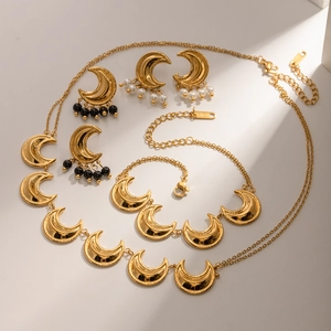 18K gold-plated stainless steel moon jewelry set with crystals and pearls on white base