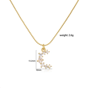 Detail view of 18K gold plated brass crescent moon pendant with 13.2mm x 10mm dimensions