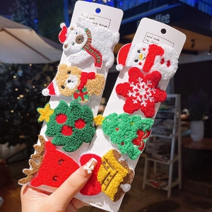 Handmade Christmas plush hair clips set featuring embroidered snowman and deer patterns