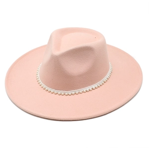 Pink wool fedora hat with elegant pearl chain decoration on flat top jazz cap
