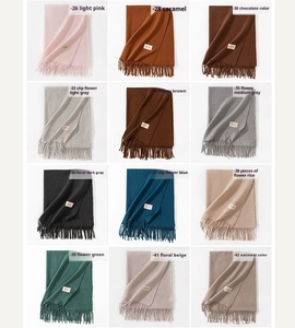 Grid layout showing 12 different colors of cashmere-feel scarves with fine knit texture