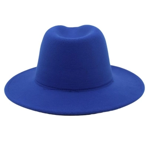 Close-up detail of a royal blue wool felt fedora hat featuring classic indented crown and wide brim