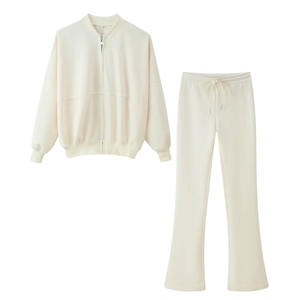 Women's two-piece cream tracksuit featuring a zip-up bomber jacket and flared pants set