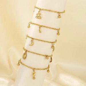 18K gold plated stainless steel anklets with moon and star charms on beige silk