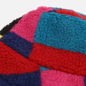 Macro detail of multi-color checkerboard sherpa fleece fabric for winter bucket hats