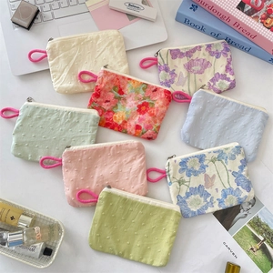 Floral and polka dot fabric makeup pouches with zip closure for small items