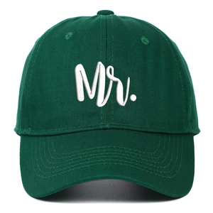 Detailed close-up of premium dark green cotton baseball cap with white Mr. embroidery