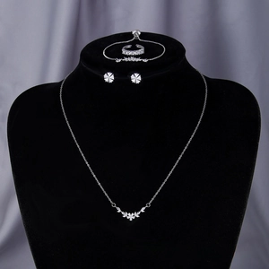 Macro shot of silver jewelry set with zircon heart wheat motif and sparkling stones
