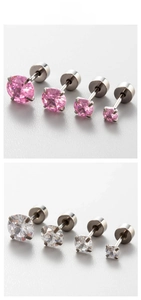 Detailed macro view of pink and white cubic zirconia stud earrings in four sizes