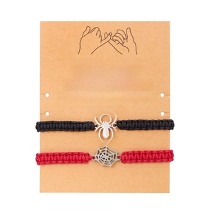 Spider and web handmade woven bracelets for couples on a sentiment display card