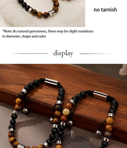 Detailed shot of tiger eye and black bead bracelet with adjustable woven cord