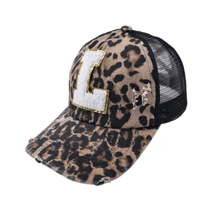 Detail of leopard print baseball cap featuring chenille L patch and breathable black mesh