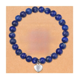 Blue natural stone beaded bracelet with silver heart charm on a sister gift card