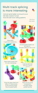 Detail of multi-track ball run blocks with spiral slides and rotating funnels for kids