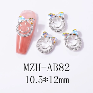 Detail of silver smiley face nail charms with aurora AB heart crystals, size 10.5*12mm