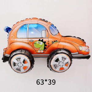 Detail view of 3D orange beetle car foil balloon with dinosaur print 63x39 cm