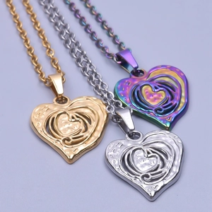 Three heart-shaped hollow necklaces in gold, silver, and rainbow steel with luxury textures