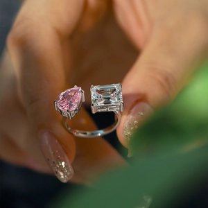 S925 sterling silver open ring featuring pink pear and clear emerald cut zircons