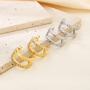 Double-layered C-shaped stud earrings in gold and silver finish with sparkling zircon stones
